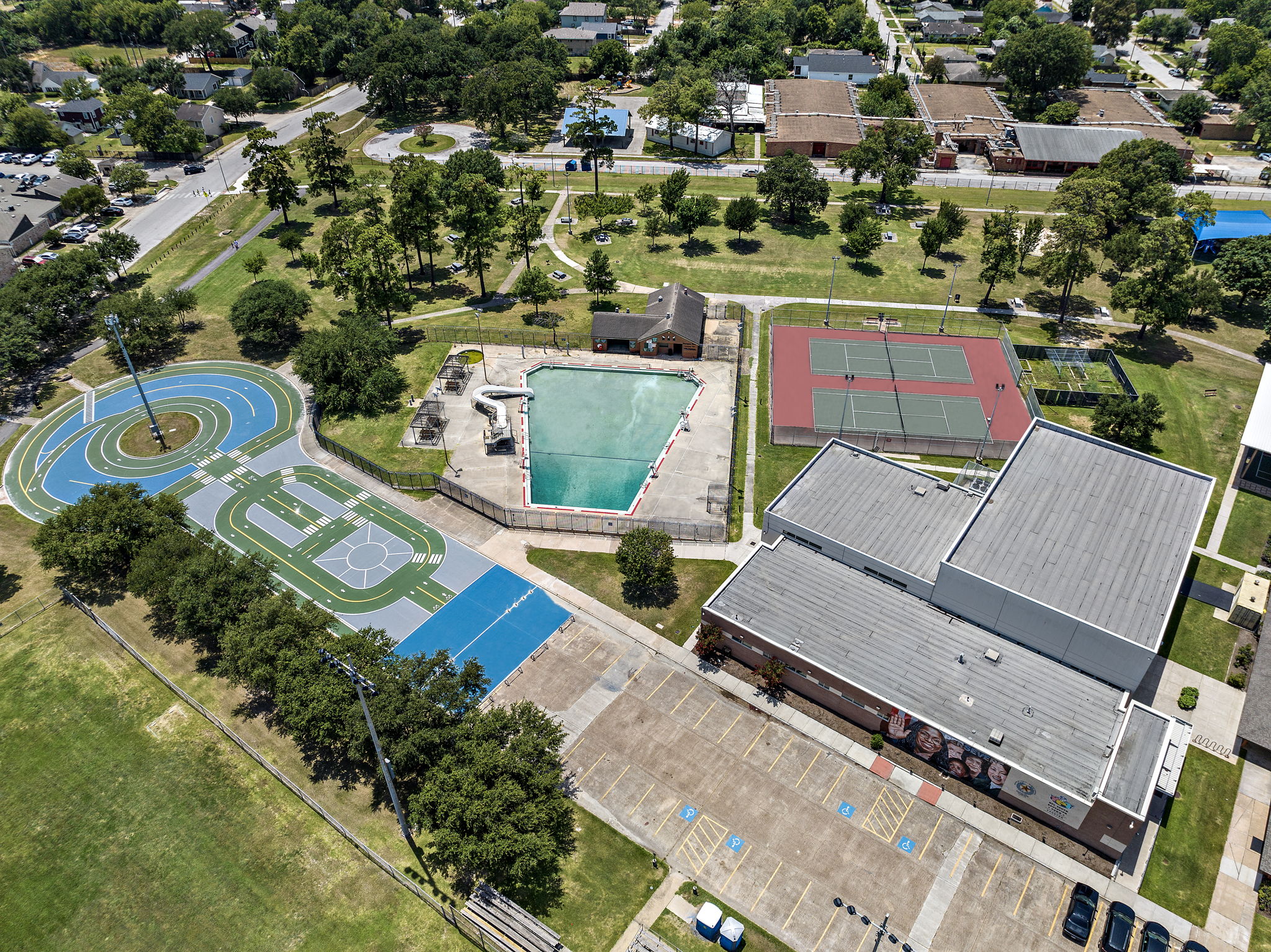 Aerial view of Finnigan Park showing the biking trail, swimming pool, and tennis courts